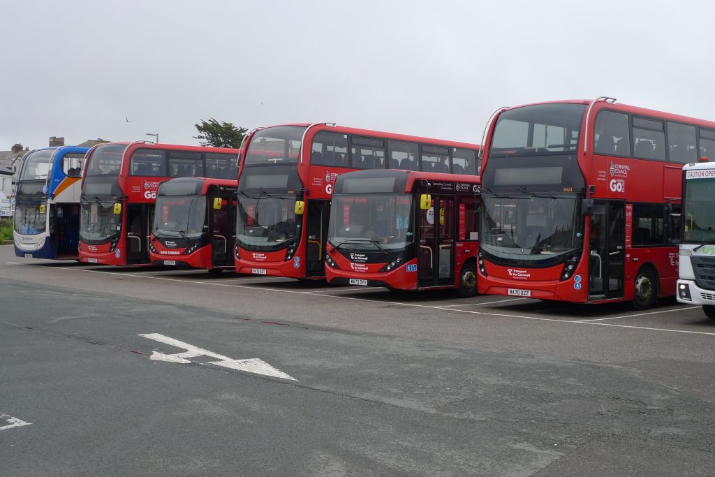 A photo of lots of red Go Cornwall buses lined up